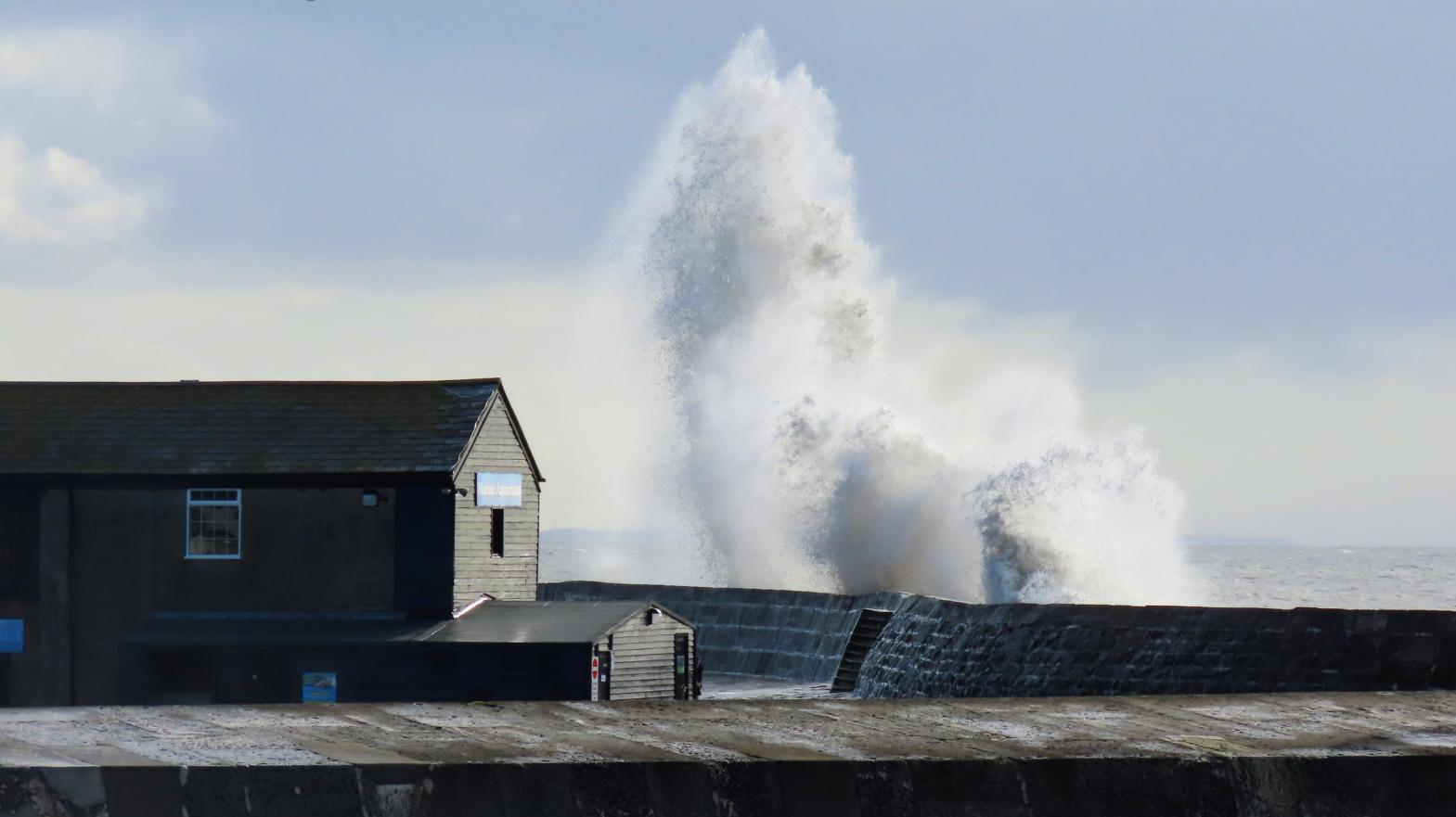 Large wave created by Storm Jorge in Lyme Regis