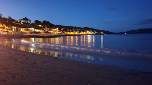 Night falls Lyme Regis beach