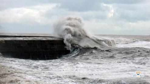 Waves breaking over the side of the Cobb